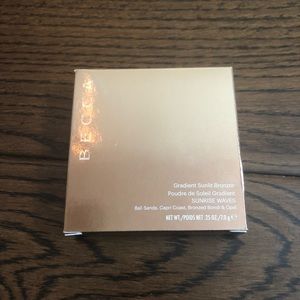 BECCA gradient sunlit bronzer in “sunrise waves”